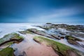 Red rock formation at Exmouth beach in Devon, UK Royalty Free Stock Photo