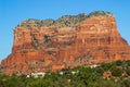 Red Rock Mountain With Layers Overlooking Houses In Arizona Desert