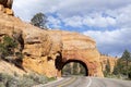 red rock tunnel and arch on the way to the Bryce canyon Royalty Free Stock Photo