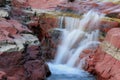 Red Rock and Waterfall - Waterton Lakes, Al Royalty Free Stock Photo