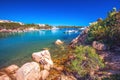 Red rocks in harbor with tourquise clear water at Porto Cervo, Costa Smeralda, Sardinia, Italy Royalty Free Stock Photo