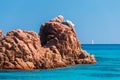 The red rocks in the northern edge of the long beach called Spiaggia di Cea, near Arbatax Sardinia, Italy