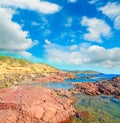 Red rocks by the sea in Sardinia Royalty Free Stock Photo