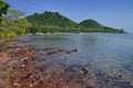 Red rocks and translucid sea at Cambodian island