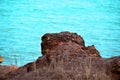 Red Rocky Outcrop Overhanging the Northern Australia Coastline