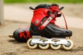 Red roller blades close-up on nature background Royalty Free Stock Photo