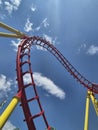 Red roller coaster track loop against a bright blue sky Royalty Free Stock Photo