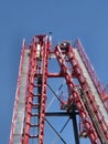 Red roller coaster track loop against a bright blue sky Royalty Free Stock Photo
