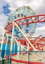 Red Rollercoaster at Luna Park with Ferris Wheel, Coney Island, close-up, New York City