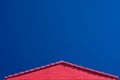 Red Roof Gable and Blue Sky