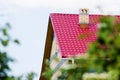 Red roof house on a background of the summer sky