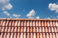 Red roof tile pattern over blue sky. Royalty Free Stock Photo