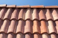 Red roof tile pattern over blue sky. Royalty Free Stock Photo