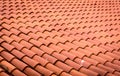 Red roof tiles or shingles on house as background image. Royalty Free Stock Photo