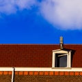 Red roof top and blue sky