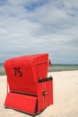 Red roofed wicker beach chair on the beach by the Baltic Sea Royalty Free Stock Photo