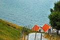 Red roofs of houses on a sea coast, Norway. Rural scandinavian landscape Royalty Free Stock Photo