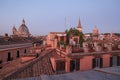 Red roofs of Rome, sights of the old city of Roma photographed at the sunrise