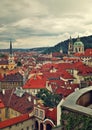 Red roofs under cloudy sky in Prague. Royalty Free Stock Photo