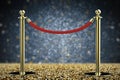 Red rope barrier with gold pillar Royalty Free Stock Photo