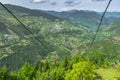 Red ropeway in Khulo, Georgia. Cable car from Khulo to Tago village. Beautiful view of green valley and mountains.Trip to Adjara