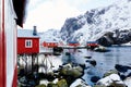 Red Rorbuer houses in Lofoten Islands, Northern Norway. Snowy landscape
