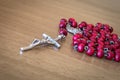 Red rosary beads with crucifix Royalty Free Stock Photo