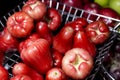 Red rose apple in steel basket Royalty Free Stock Photo