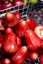 Red rose apple in steel basket Royalty Free Stock Photo