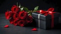 Red rose bouquet and black gift box on dark background Royalty Free Stock Photo