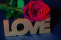 Red rose with candle and love written Royalty Free Stock Photo