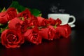 Red rose with cup of coffee in the evening. Royalty Free Stock Photo