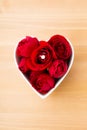 Red rose and diamond ring inside heart shape bowl Royalty Free Stock Photo