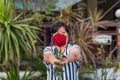 Red rose flower with human hand in Valentine`s Day