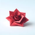 Origami red rose flower on light blue background, paper flower art