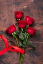 Red rose flowers bouquet on wooden background Valentine`s day greeting card Copy space Top view Royalty Free Stock Photo