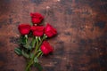 Red rose flowers bouquet on wooden background Valentine`s day greeting card Copy space Top view Royalty Free Stock Photo