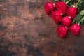 Red rose flowers bouquet on wooden background Valentine`s day greeting card. Copy space. Top view Royalty Free Stock Photo