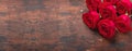 Red rose flowers bouquet on wooden background Valentine`s day horizontal banner. Copy space. Top view Royalty Free Stock Photo