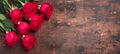 Red rose flowers bouquet on wooden background Valentine`s day horizontal banner. Copy space. Top view Royalty Free Stock Photo