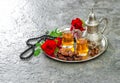 Red rose flowers tea dates Islamic holidays decoration Royalty Free Stock Photo