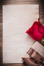 Red rose gift box blank sheet of paper holiday concept