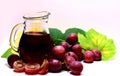 Red rose grapes and glass jug bottle Royalty Free Stock Photo