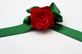 Red rose with green petals made by hand from satin ribbon Royalty Free Stock Photo