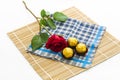 Red rose with handkerchief and chocolate Ball, placemat Royalty Free Stock Photo