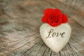 Red Rose and Heart On Wooden Background. Love and Valentines Day Concept. Royalty Free Stock Photo