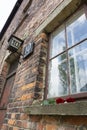 Red rose left on the window of the 10th block building from Auschwitz