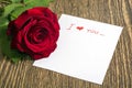 Red rose and love note Royalty Free Stock Photo