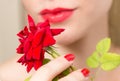 Red rose, red manicure and red lips Royalty Free Stock Photo