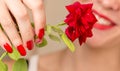 Red rose, red manicure and red lips Royalty Free Stock Photo